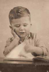 [old picture of little boy reading]