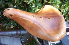 [a leather bike seat]