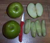 [apples, one cut up]